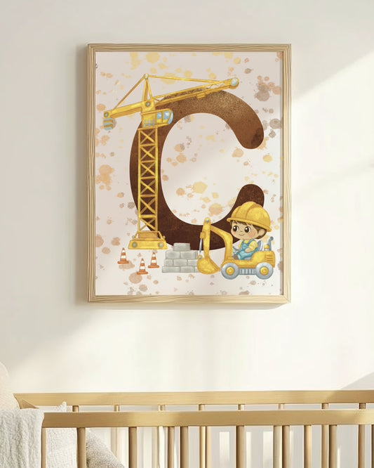 Nursery room with a crib and framed artwork of a letter 'C' with a construction theme.